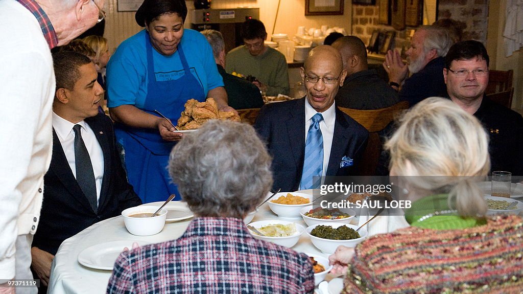 A waitress brings a plate of fried chick