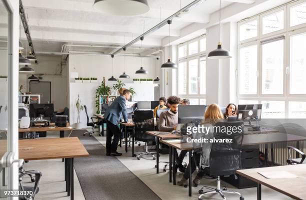 business people working in modern office space - office interior imagens e fotografias de stock
