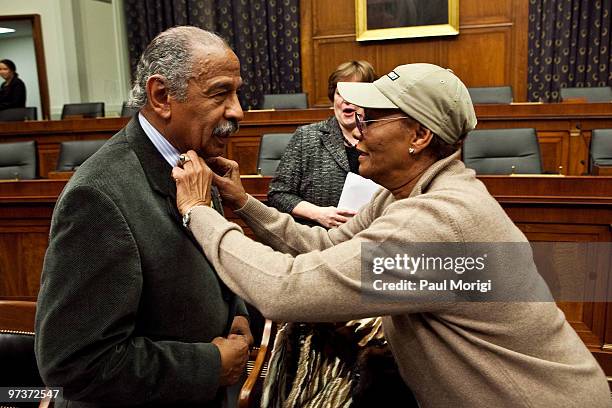 Grammy award-winning recording artist Dionne Warwick helps Congressman Charles Rangel adjust his tie at the musicFIRST Coalition's 2010 campaign...