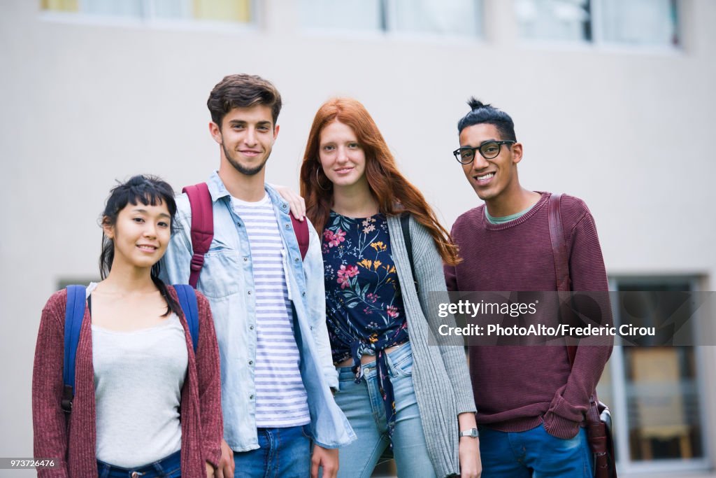 College students standing together outdoors, portrait