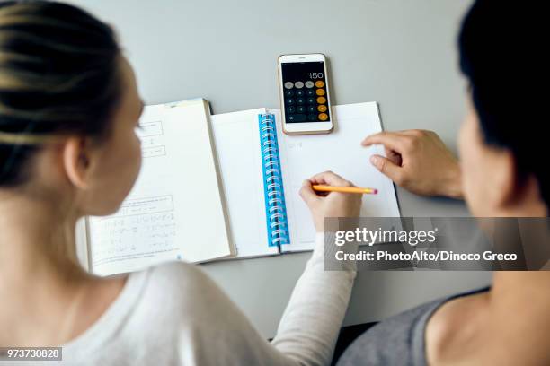 students working together on mathematics assignment - high school maths stock pictures, royalty-free photos & images