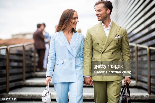 Couple Martina Gronowska wearing blue double breasted linen suit Massimo Dutti, Gestuz shoes, Michael Kors bag and Michal Gronowski wearing coton...