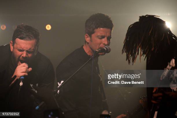 Noel Gallagher performs with Jamie Reynolds and Seye Adelekan of YOTA in concert at XOYO on June 13, 2018 in London, England.