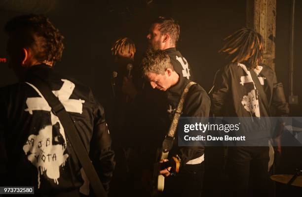 Noel Gallagher performs with Jeff Wootton, Young Lazarus, Jamie Reynolds and Seye Adelekan of YOTA in concert at XOYO on June 13, 2018 in London,...