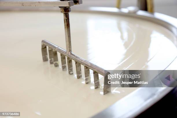 machine slicing through curdled cheese curds in vat - cheese maker stock pictures, royalty-free photos & images