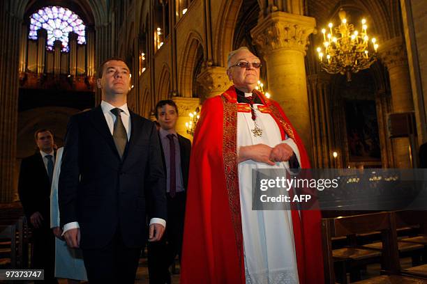 Russian President Dmitry Medvedev walk with Mgr Patrick Jacquin as they visit the Notre Dame cathedral, in Paris, on March 2, 2010. Dmitry Medvedev...