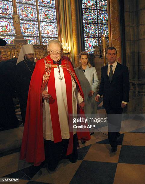 Russian President Dmitry Medvedev his wife Svetlana walk with Mgr Patrick Jacquin as they visit the Notre Dame cathedral, in Paris, on March 2, 2010....