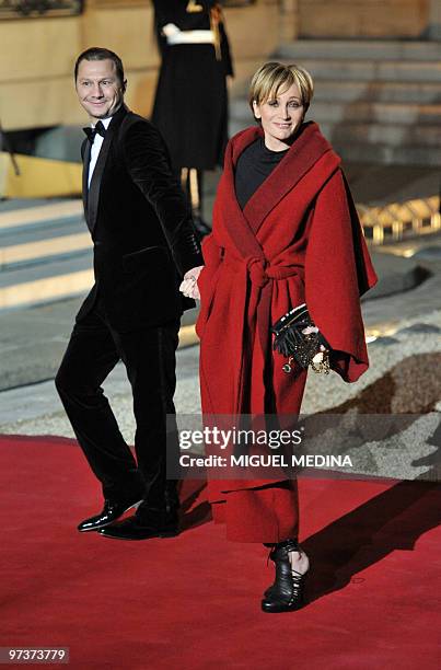 French singer Patricia Kaas and a companion arrive at the Elysee palace in Paris to attend an official diner between French President Nicolas...