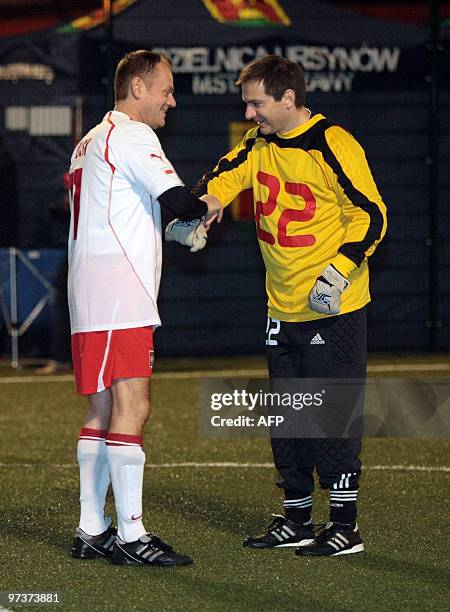 Polish Prime Minister Donald Tusk and Prime Minister of Hungary Gordon Bajnai shake hands on the pitch during a friendly football match on March 2,...