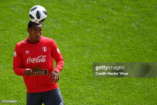 Andy Polo of Peru heads the ball during a training session at Arena Khimki on June 12, 2018 in Khimki, Russia.