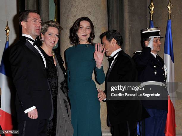 Russian President Dmitry Medvedev and his wife Svetlana Medvedeva arrive to attend a state dijnner in their honour, hosted by French President...