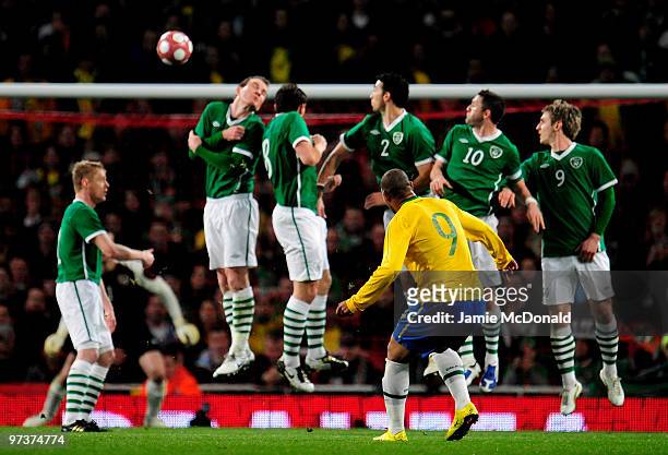 Adriano of Brazil takes a free kick during the International Friendly match between Republic of Ireland and Brazil played at Emirates Stadium on...