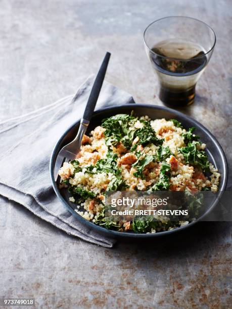 still life with bowl of quinoa salmon kale salad, overhead view - quinoa salad stock pictures, royalty-free photos & images