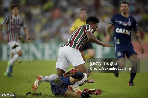 Pablo Dyego of Fluminense struggles for the ball with Gustavo Henrique of Santos during the match between Fluminense and Santos as part of...