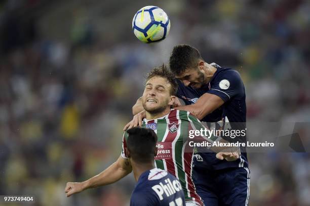 Luan Peres of Fluminense struggles for the ball with Gustavo Henrique of Santos during the match between Fluminense and Santos as part of Brasileirao...