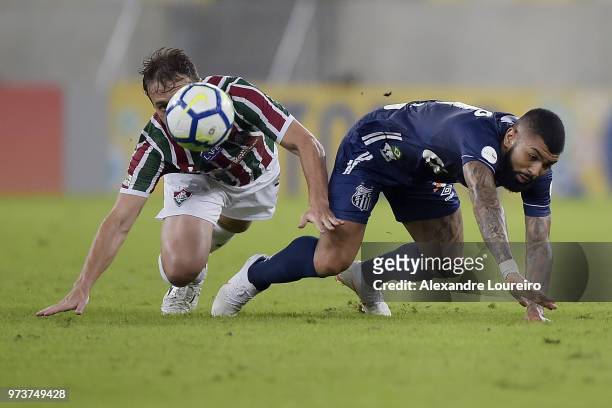 Luan Peres of Fluminense struggles for the ball with Gabriel Barbosa of Santos during the match between Fluminense and Santos as part of Brasileirao...