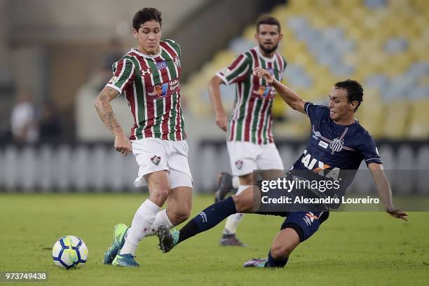 Pedro Santos of Fluminense struggles for the ball with Diego Pituca of Santos during the match between Fluminense and Santos as part of Brasileirao...