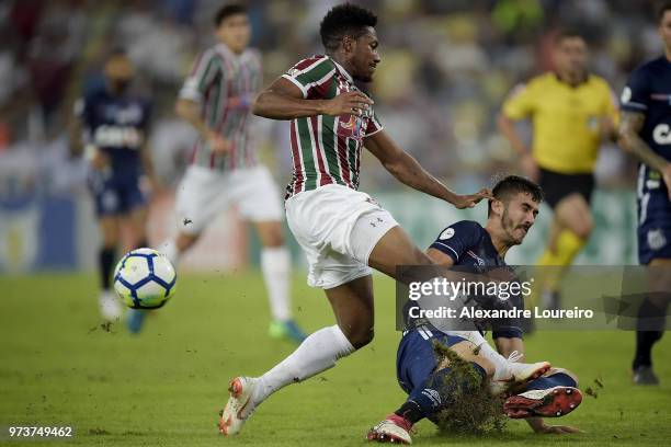 Pablo Dyego of Fluminense struggles for the ball with Gustavo Henrique of Santos during the match between Fluminense and Santos as part of...