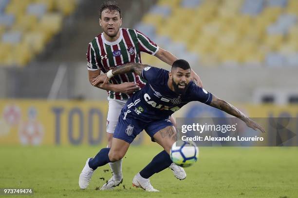 Luan Peres of Fluminense struggles for the ball with Gabriel Barbosa of Santos during the match between Fluminense and Santos as part of Brasileirao...