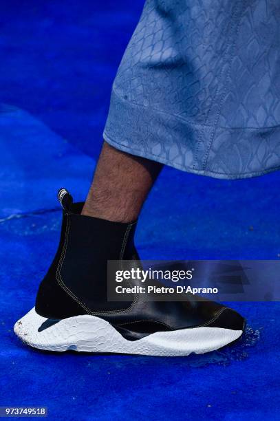 Model, shoe detail, walks the runway at the Roberto Cavalli show during the 94th Pitti Immagine Uomo on June 13, 2018 in Florence, Italy.