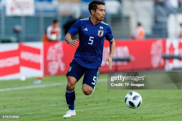 Yuto Nagatomo of Japan controls the ball during the international friendly match between Switzerland and Japan at the Stadium Cornaredo on June 8,...