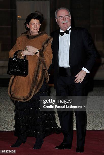 French oil giant Total chief executive Christophe de Margerie arrives with his wife to attend a state dinner honouring visiting Russian President...