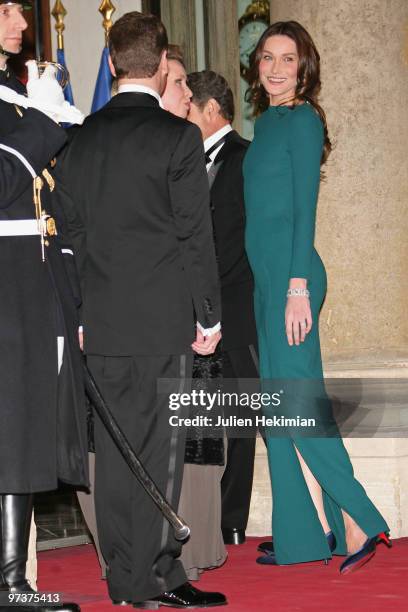 Russian President Dmitry Medvedev and his wife Svetlana Medvedeva arrive to attend a state dinner in their honour, hosted by French President Nicolas...