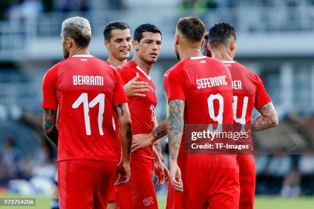 Haris Seferovic of Switzerland celebrates after scoring his team`s second goal with team mates during the international friendly match between...