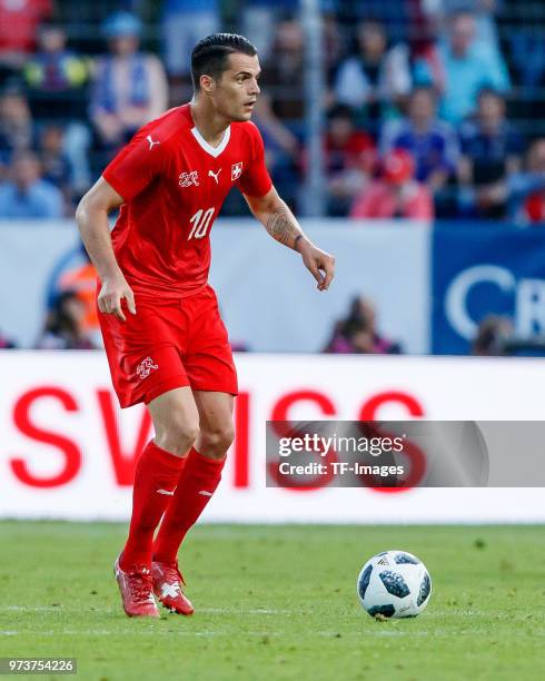 Granit Xhaka of Switzerland controls the ball during the international friendly match between Switzerland and Japan at the Stadium Cornaredo on June...