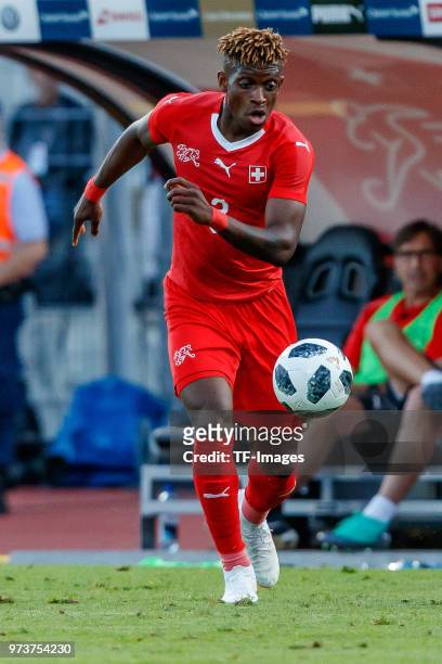 Francois Moubandje of Switzerland controls the ball during the international friendly match between Switzerland and Japan at the Stadium Cornaredo on...