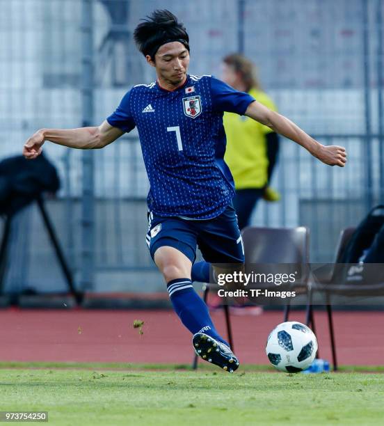 Gaku Shibasaki of Japan controls the ball during the international friendly match between Switzerland and Japan at the Stadium Cornaredo on June 8,...