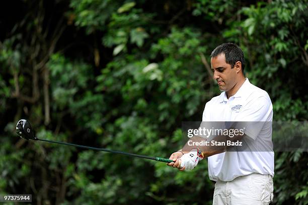 Driver Juan Pablo Montoya of Colombia prepares to hit driver at the second tee box during the Pro-Am round at the Pacific Rubiales Bogota Open...