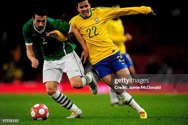 Nilmar of Brazil battles with Stephen Kelly of Ireland during the International Friendly match between Republic of Ireland and Brazil played at...