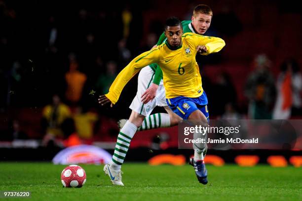 Michel Bastos of Brazil battles with James McCarthy of Ireland during the International Friendly match between Republic of Ireland and Brazil played...