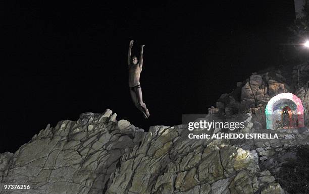Cliff diver jumps from 'La Quebrada' cliff in Acapulco, Mexico, on March 1, 2010. The tradition of 'La Quebrada' goes back to 1934, when two...