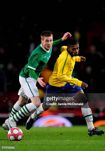 Michel Bastos of Brasil battles with James McCarthy of Ireland during the International Friendly match between Republic of Ireland and Brazil played...
