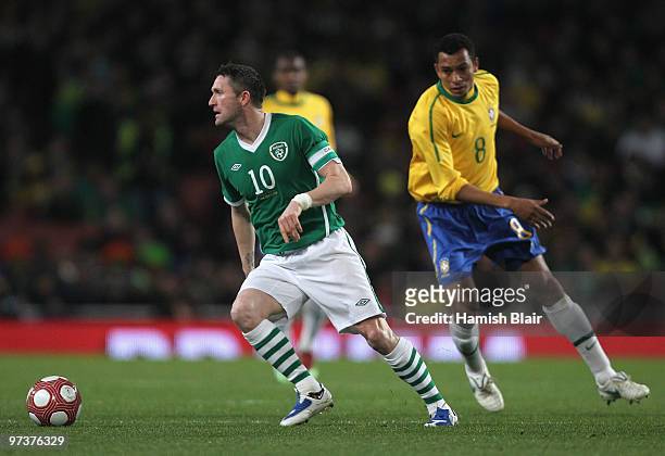 Robbie Keane of Ireland runs off Gilberto Silva of Brazil during the International Friendly match between Republic of Ireland and Brazil played at...