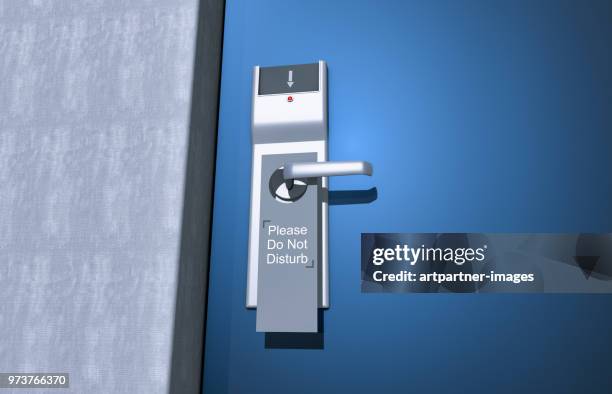 door with do not disturb sign - manilla fotografías e imágenes de stock