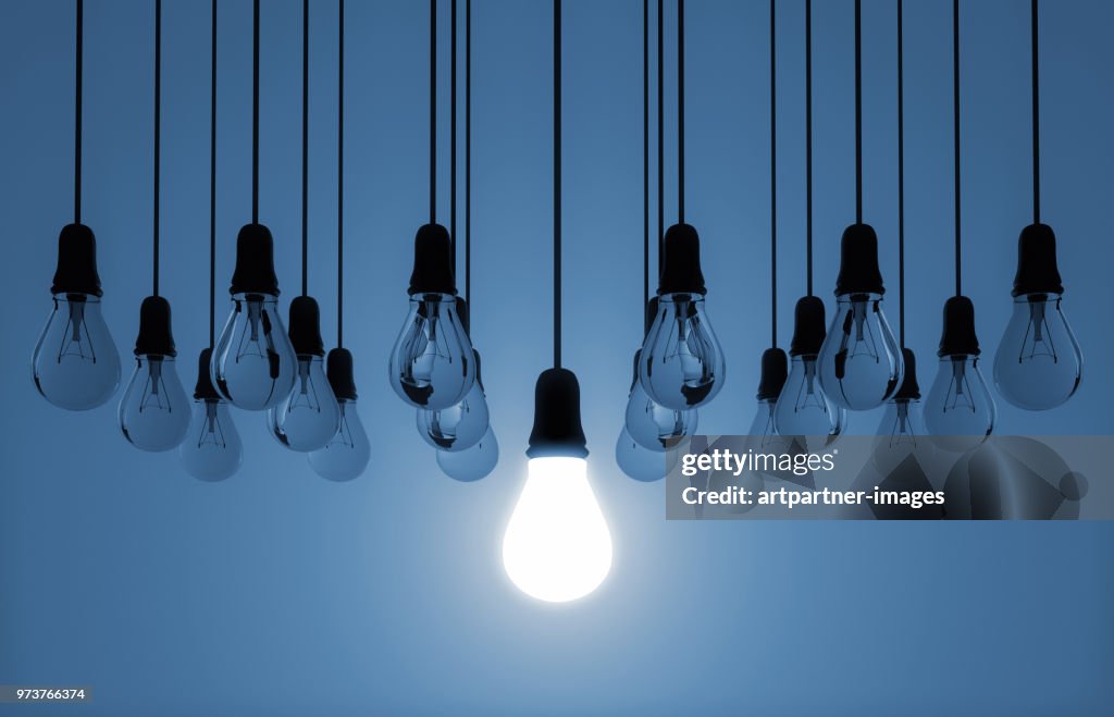 Hanging light bulb switched on