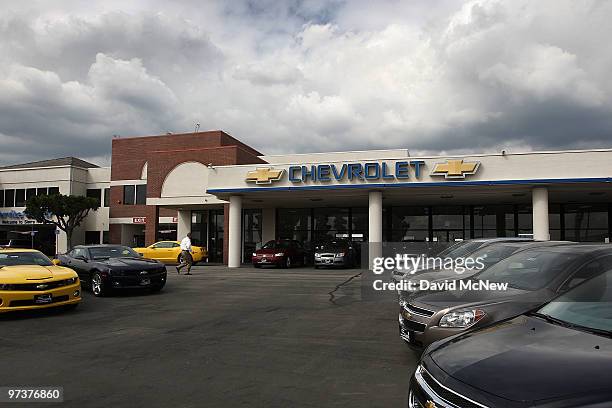 General Motors cars are displayed at the Sierra Chevrolet auto dealership as storm clouds build in the distance on March 2, 2010 in Monrovia,...