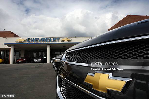 General Motors cars are displayed at the Sierra Chevrolet auto dealership as storm clouds build in the distance on March 2, 2010 in Monrovia,...