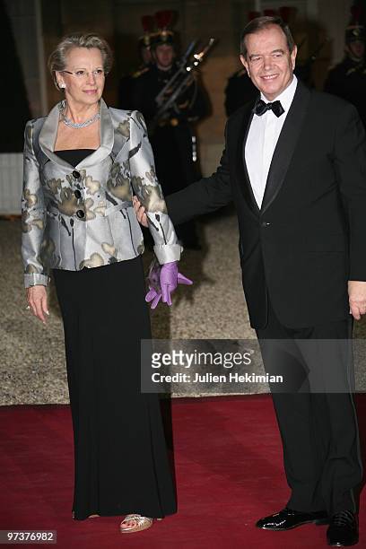 French Interior Minister Michelle Alliot-Marie arrives with husband to attend a state dinner at Elysee Palace on March 2, 2010 in Paris, France.