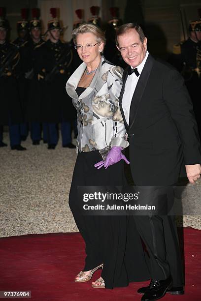 French Interior Minister Michelle Alliot-Marie arrives with husband to attend a state dinner at Elysee Palace on March 2, 2010 in Paris, France.