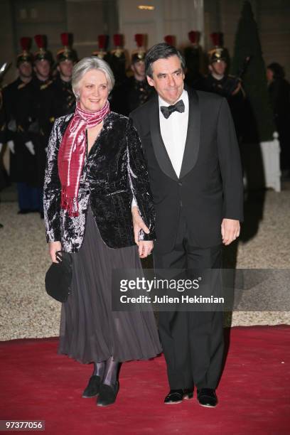 French Prime Minister Francois Fillon arrives with wife Penelope to attend a state dinner honouring visiting Russian President Dmitry Medvedev at...