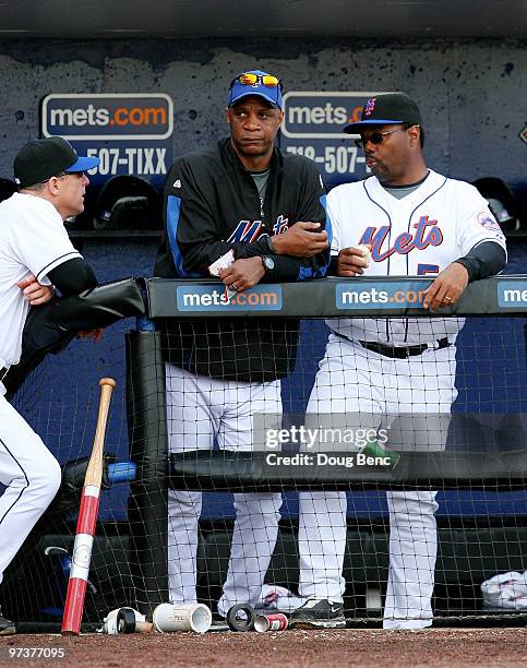 Former New York Mets outfielder Darryl Strawberry watches from the dugout as the Mets take on the Atlanta Braves during a spring training game at...