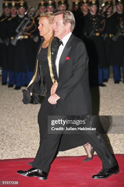 Bernard Kouchner and his wife Christine Ockrent arrive to attend a state dinner at Elysee Palace on March 2, 2010 in Paris, France.