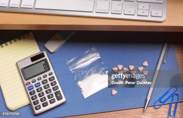 cocaine and ecstasy pills in office desk - drugs cocaine stock pictures, royalty-free photos & images