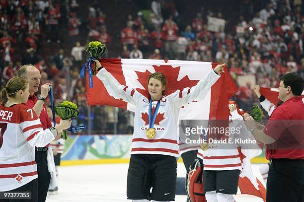 Winter Olympics: Canada Hayley Wickenheiser victorious with flag after winning Women's Gold Medal Game - Game 20 vs USA at Canada Hockey Place....