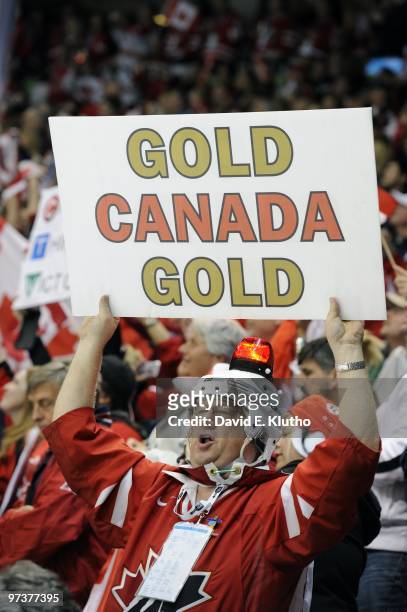 Winter Olympics: Team Canada fan in stands with GOLD CANADA GOLD sign during Women's Gold Medal Game - Game 20 vs USA at Canada Hockey Place....