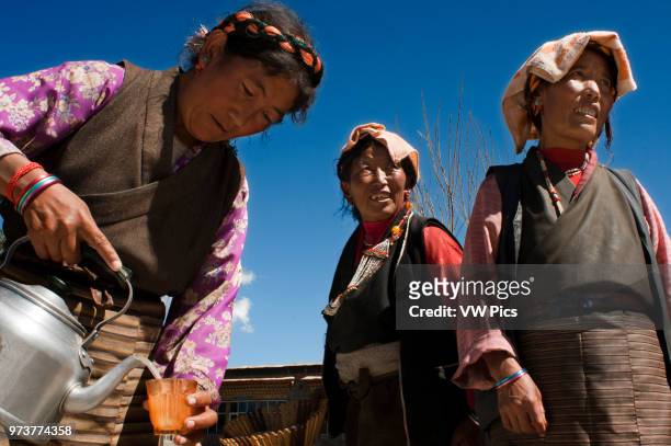 Family celebrates the graduation of a relative in the village of Bainans, located along the road separating Shigatse from Gyantse, Tibet, China.